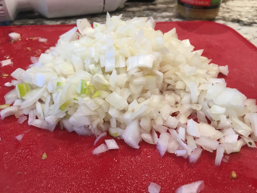 chopped onions on a cutting board
