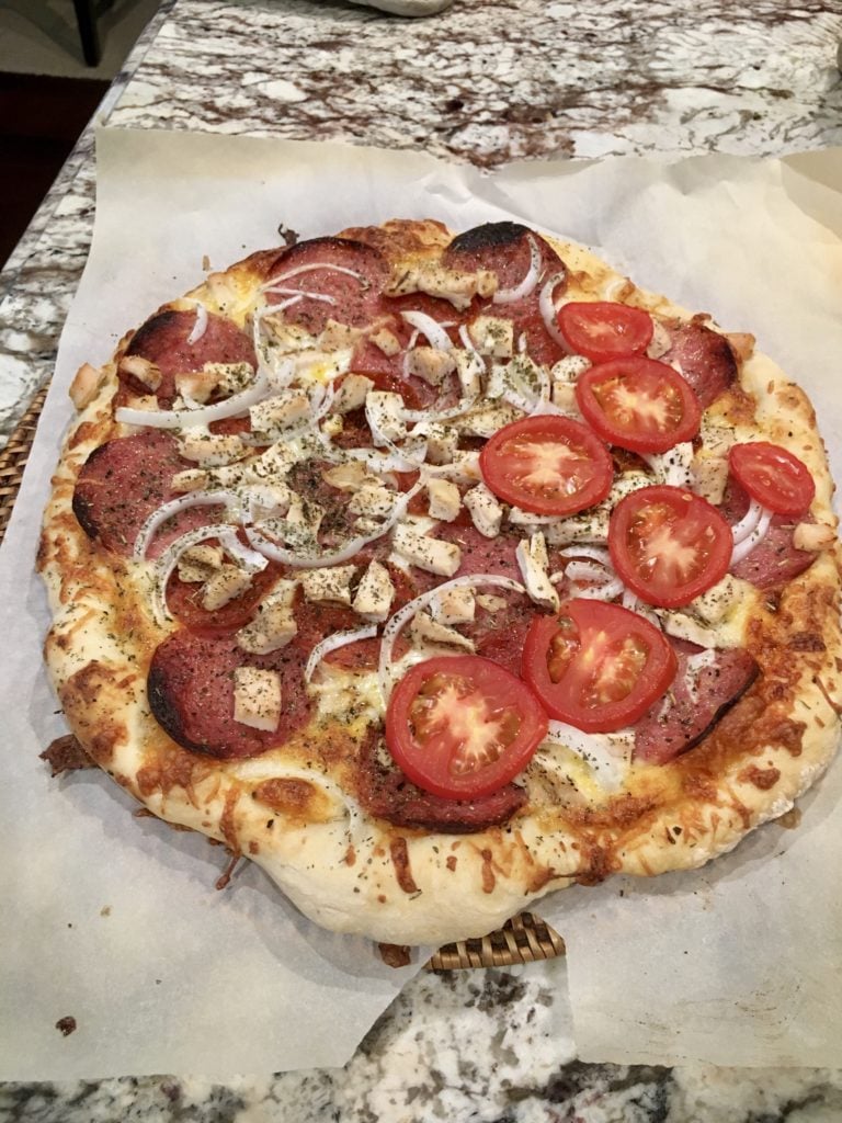 pizza on top of parchment paper.