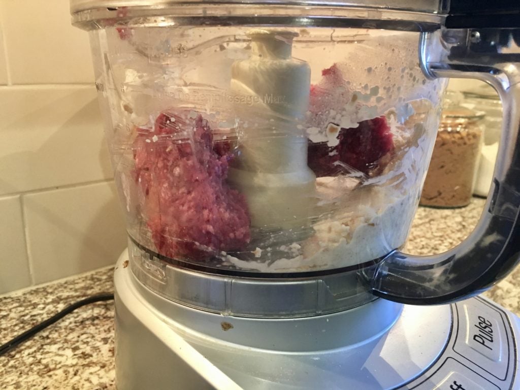 mixing the meat sauce ingredients in a food processor
