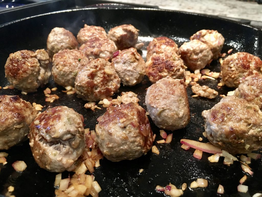 cooking the meatballs until brown