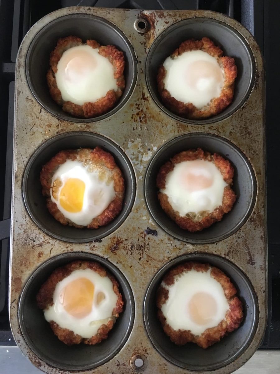 Six potato egg nests in a muffin tin.