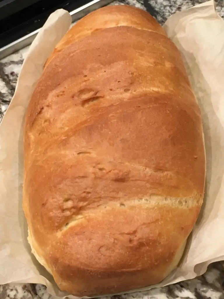 baked French bread on a parchment paper.