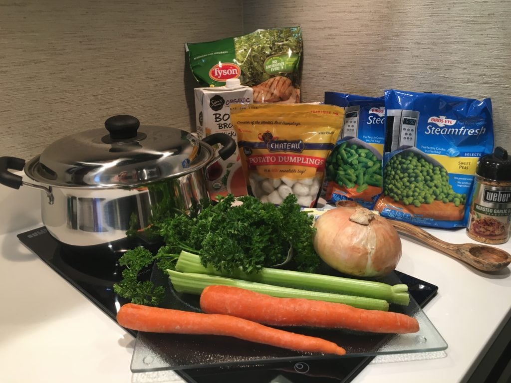 Ingredients for chicken stew with dumplings - onions, carrots, chateau potato dumplings, roasted garlic, celery, flour, peas, 