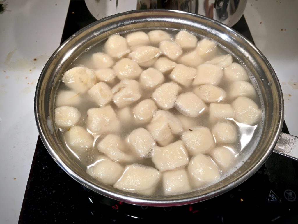 potato dumplings floating on water.
