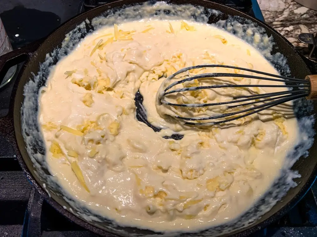 a skillet of cheese sauce