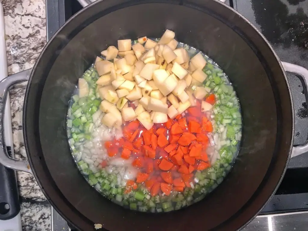 simmering veggies in clam juice