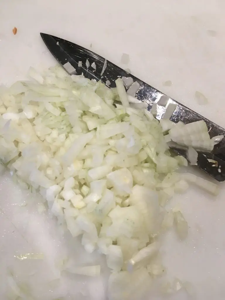 chopped onions on a chopping board
