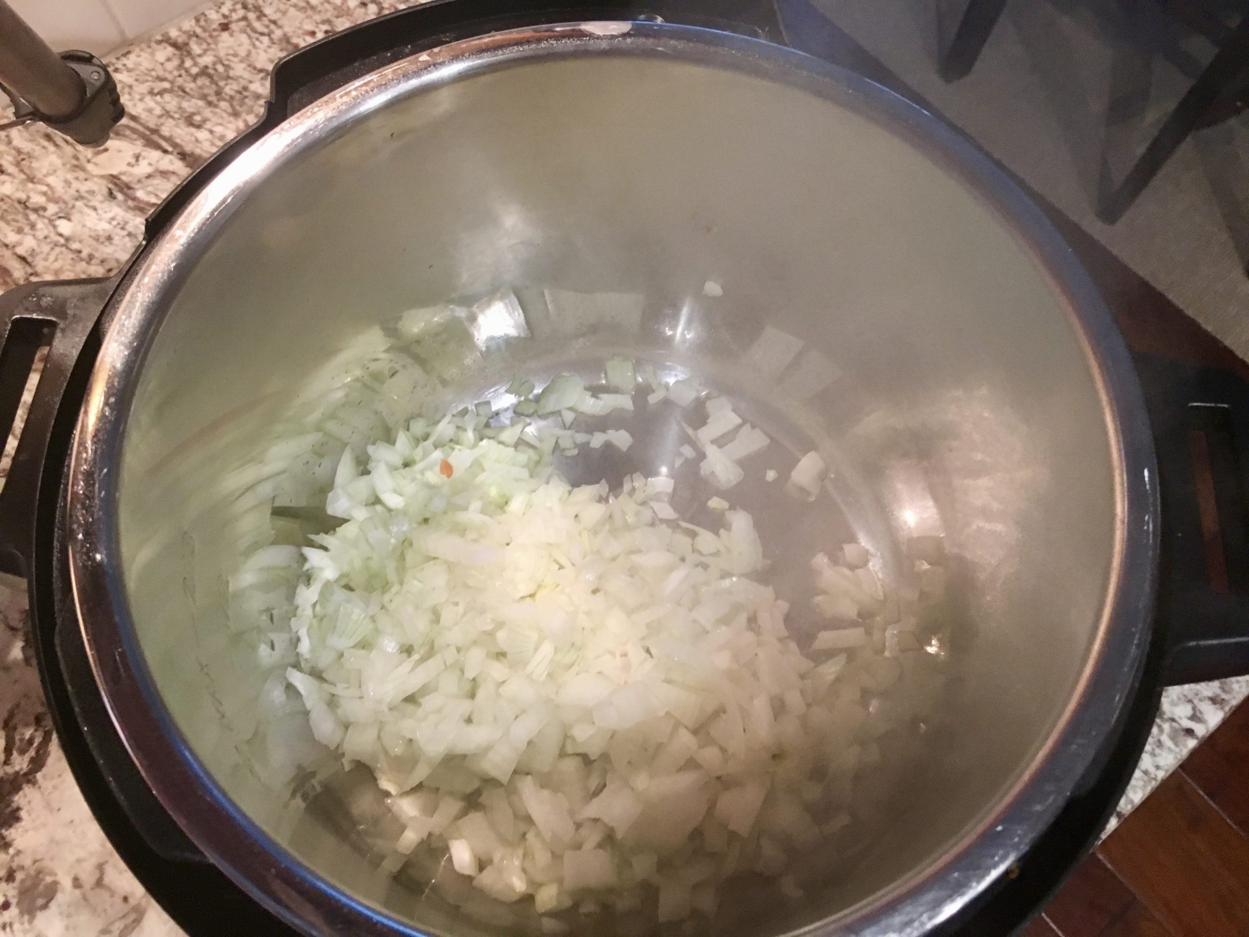 onions being sauted in the Instant Pot