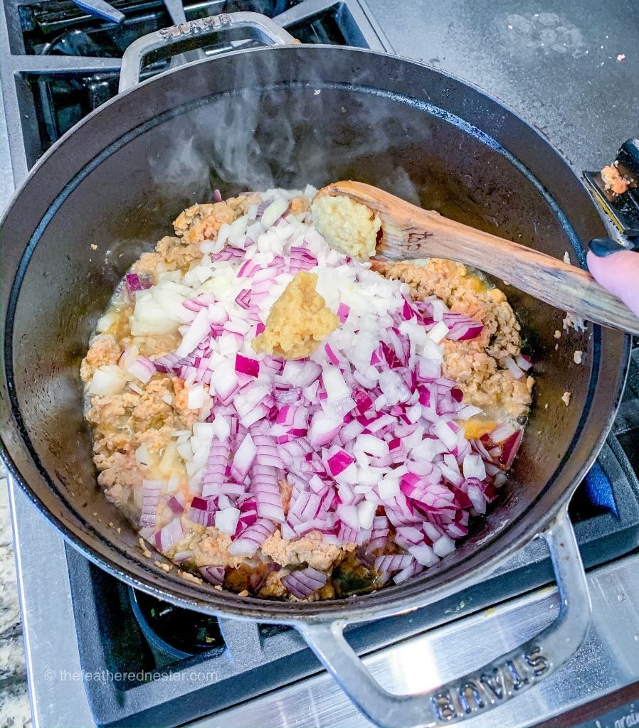 Preparing the soup in a cast iron dutch oven.