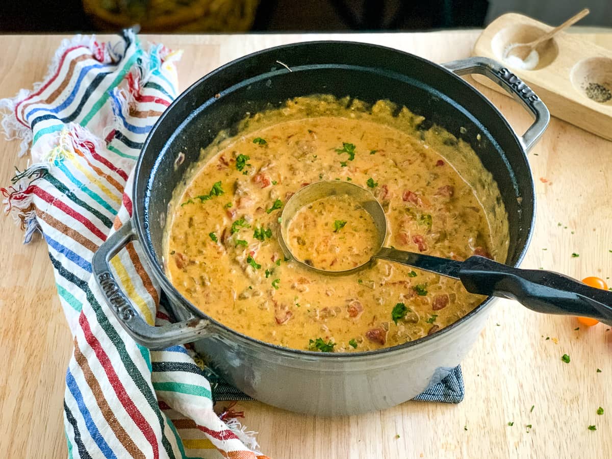 Ladle in a pot of beefy Velveeta cheese soup.