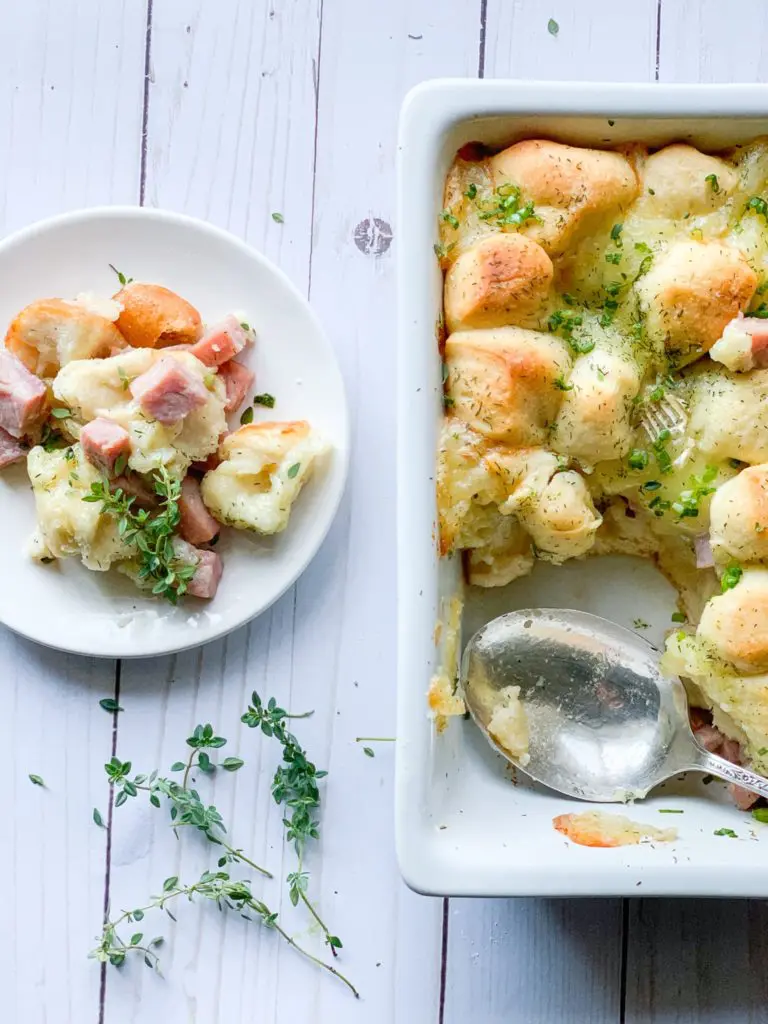 make ahead brunch casserole, next to a plated serving.