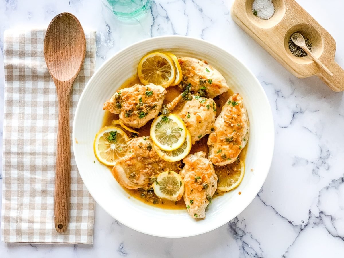 A plate of chicken piccata