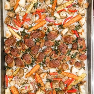 a sheet pan of sausage and sliced vegetables