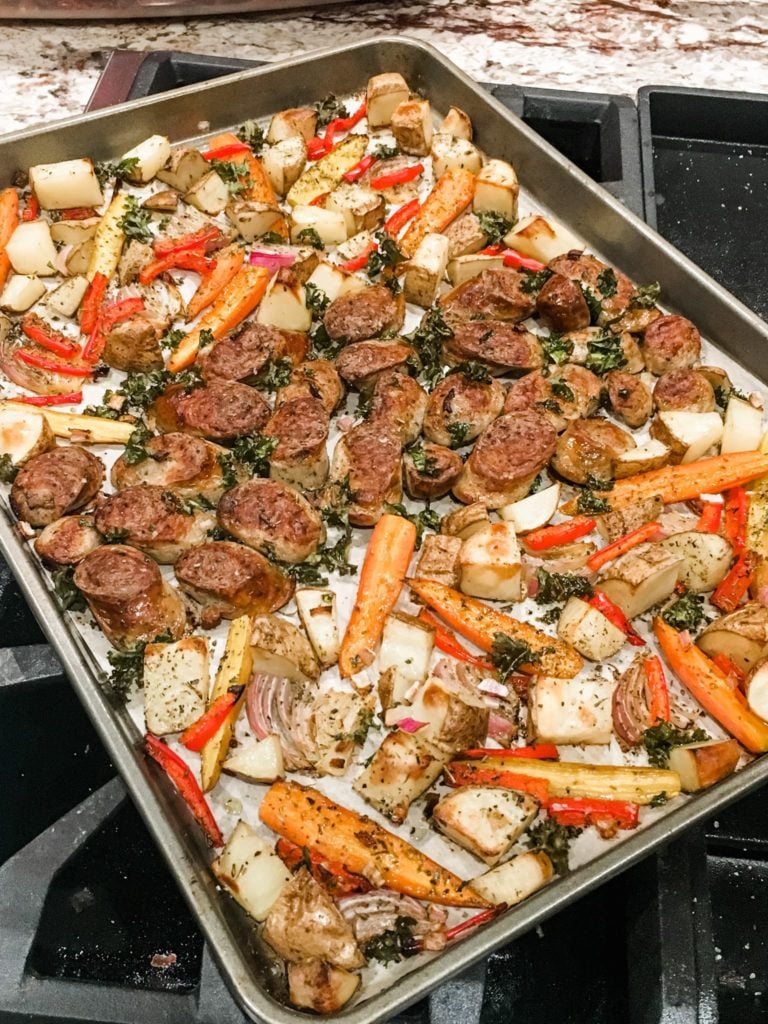 a tray of sliced sausage and vegetables.