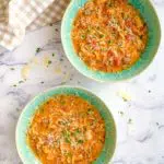 two green bowls of lasagna soup cooked in a pressure cooker