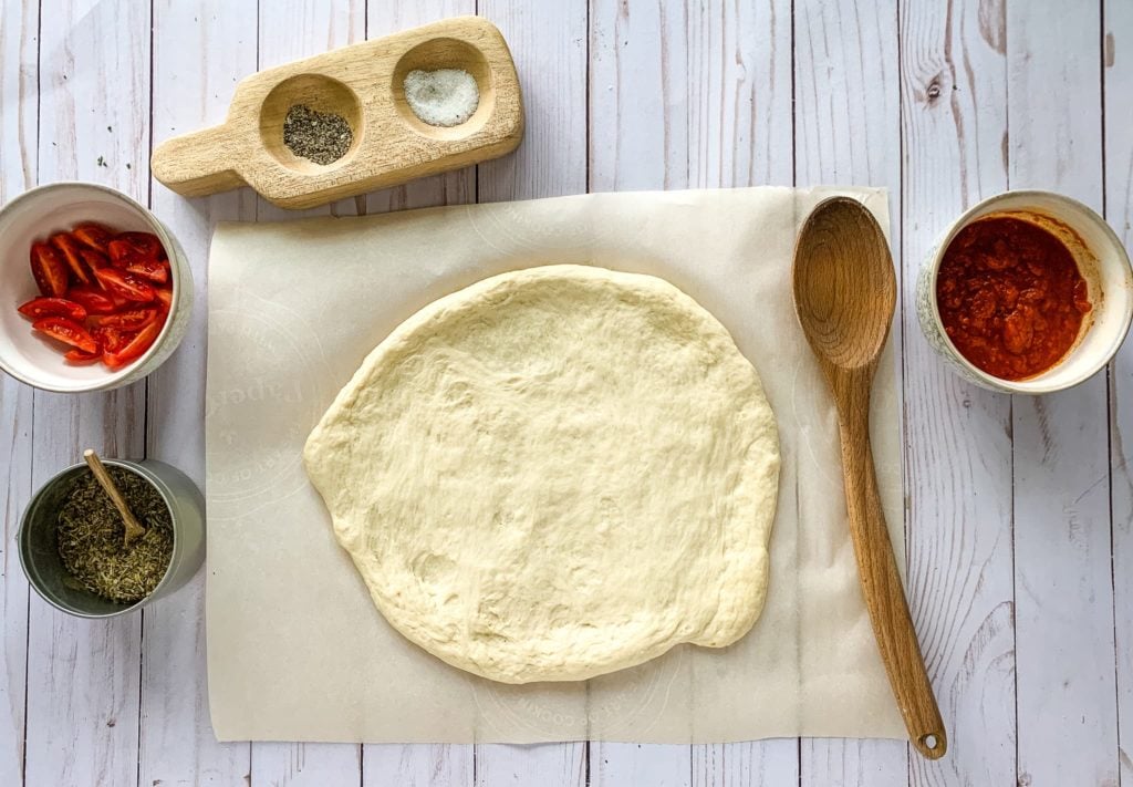 Pizza Crust prep on a parchment paper.