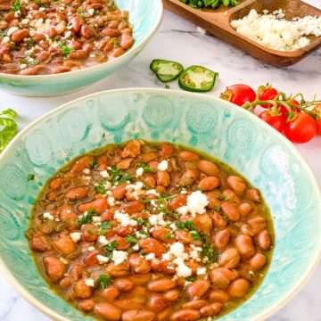 pinto beans in bowls with toppings