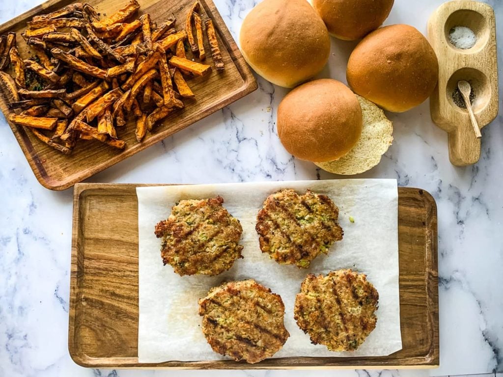 Burgers and buns with roasted sweet potato fries ready to serve