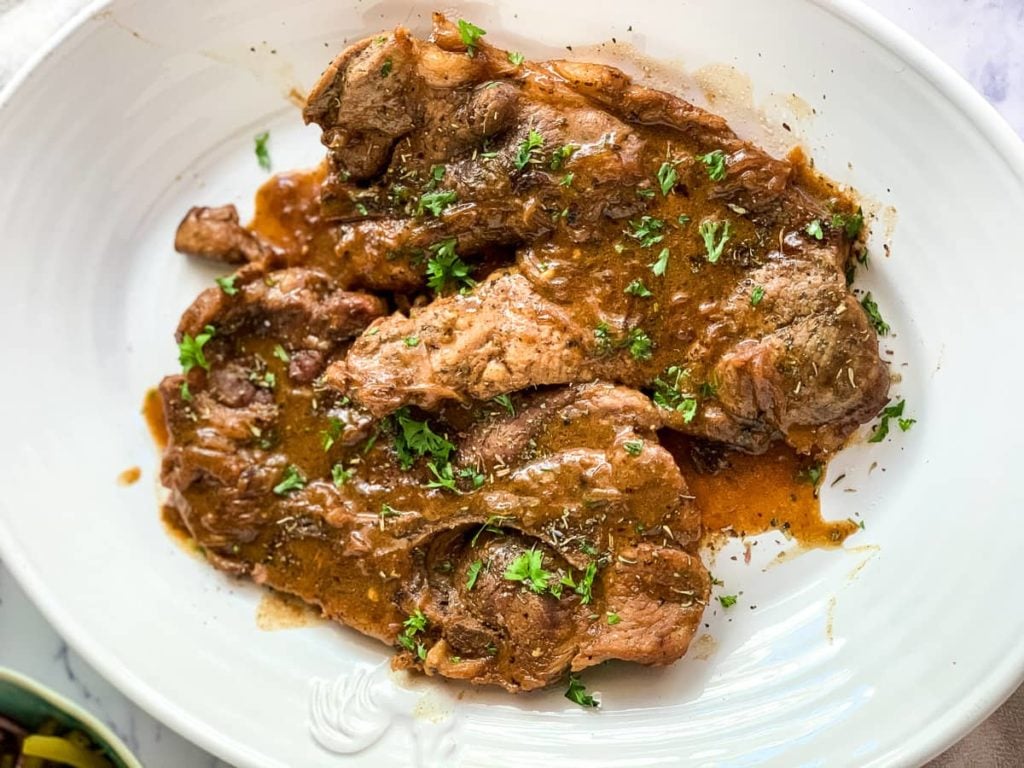 Pork Chops with gravy on a serving platter