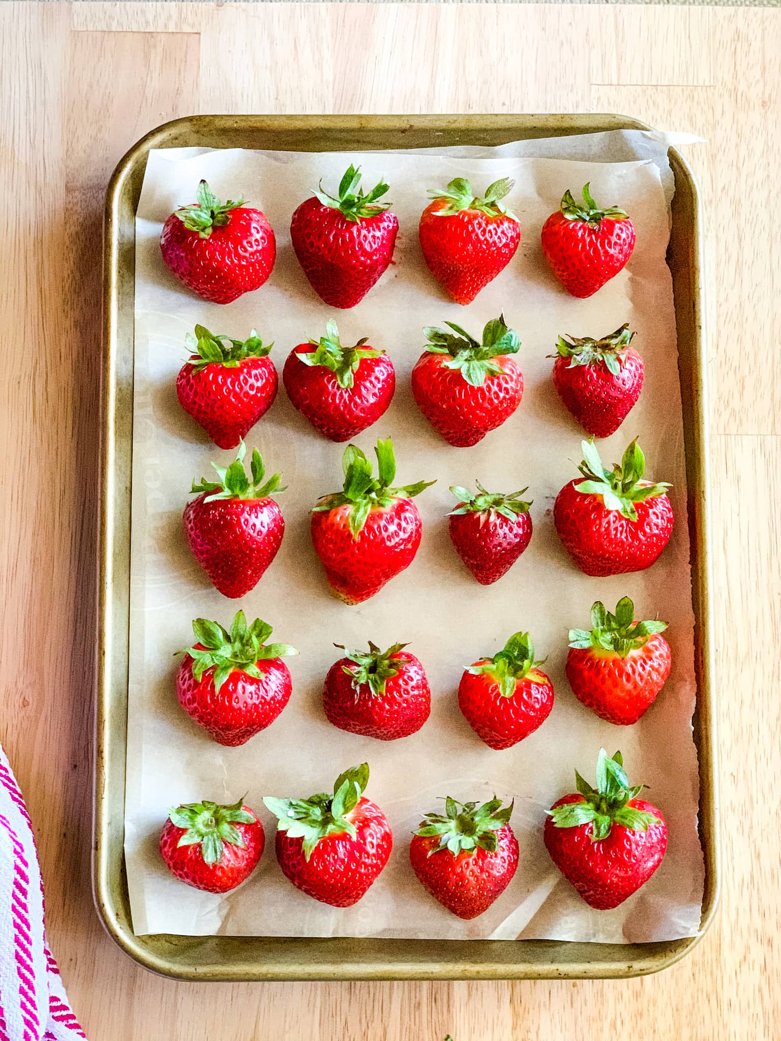 A tray of frozen strawberries.