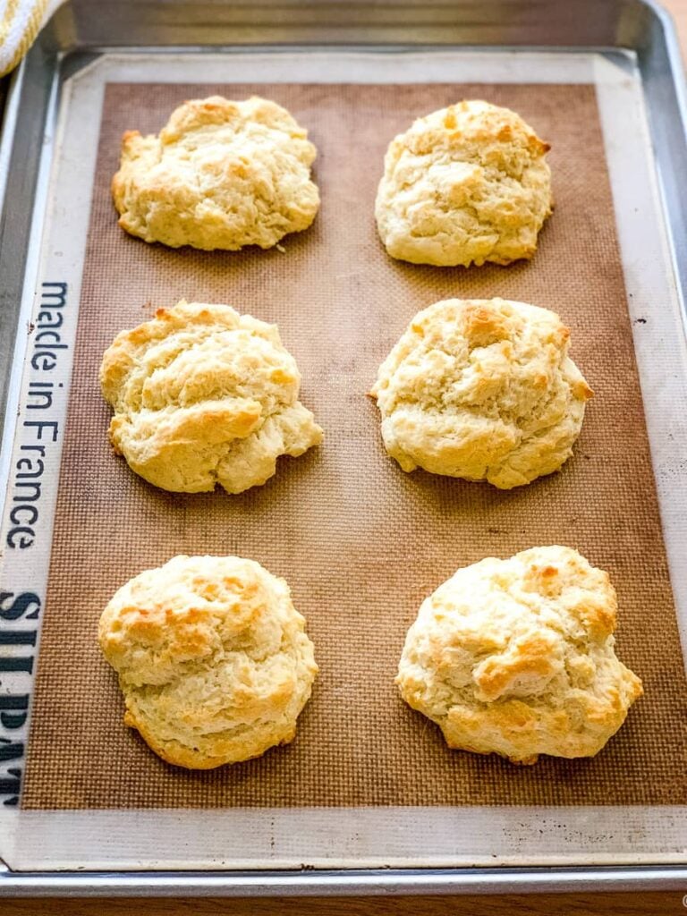 Baking sheet of drop biscuits made with self rising flour.