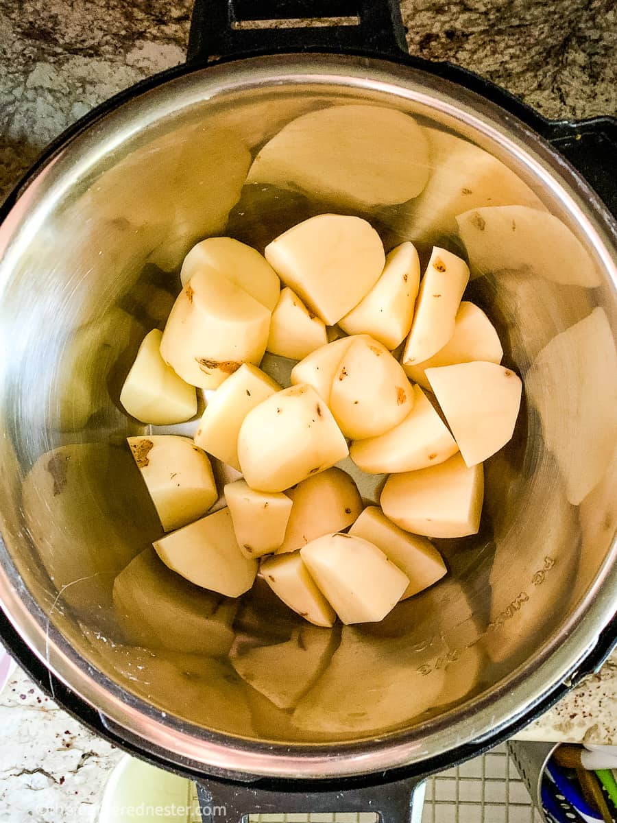 Peeled and cut potatoes in Instant Pot pressure cooker.