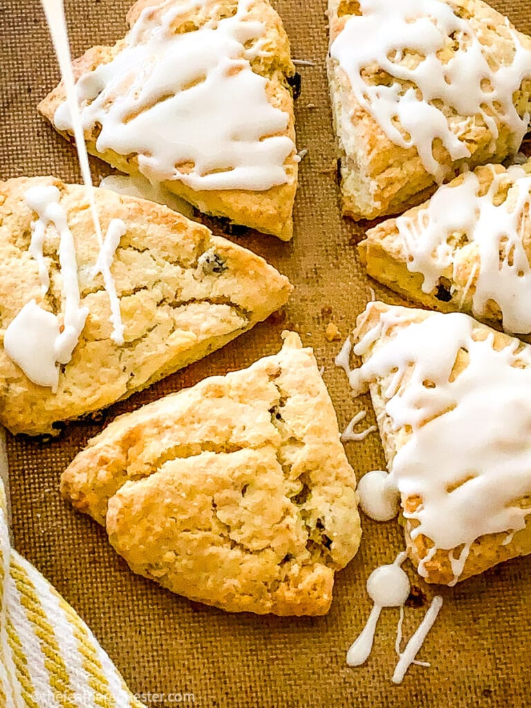 cut cranberry almond scones on a wooden platter ready to serve