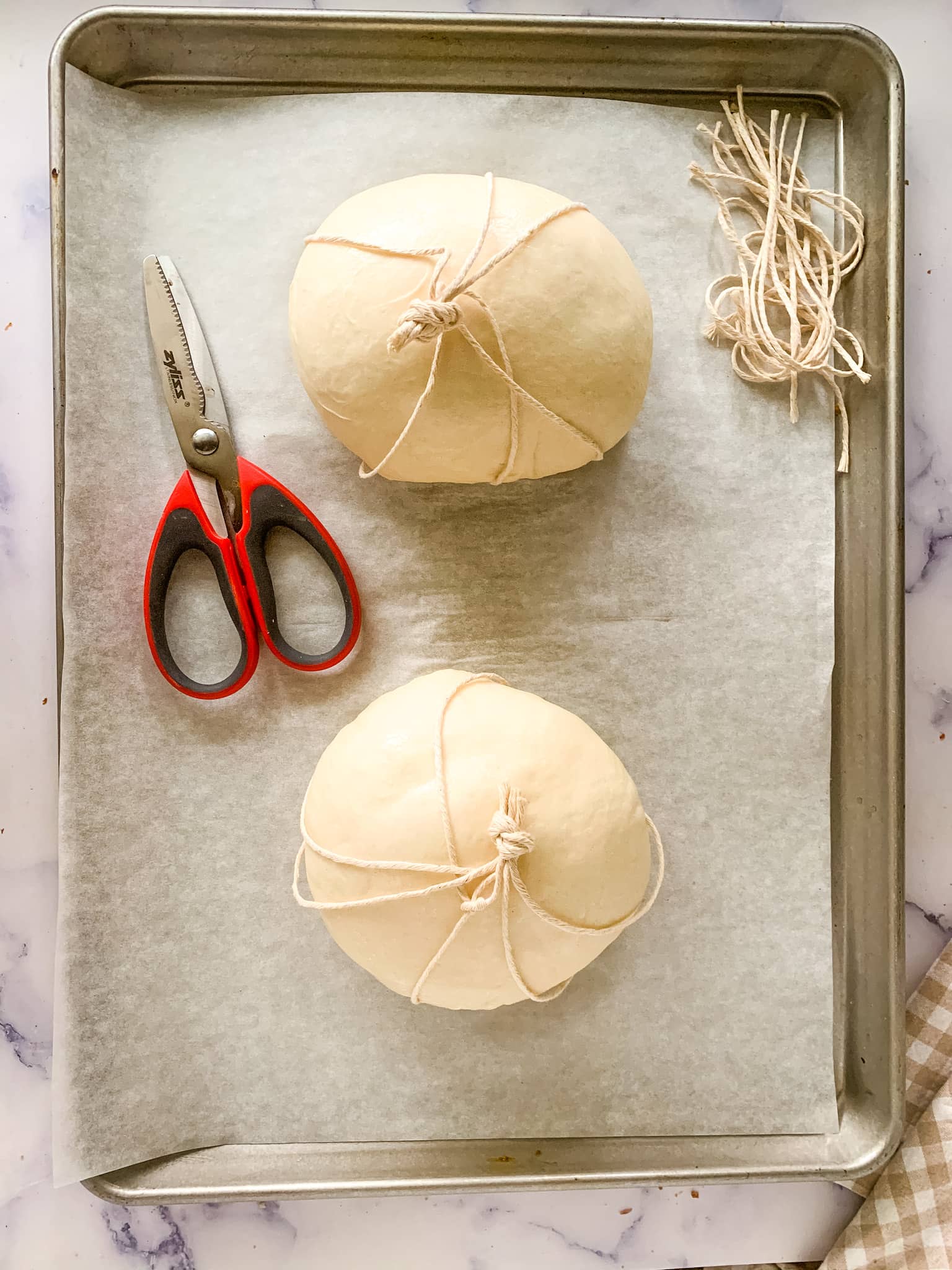 pumpkin bread bowl on a sheet pan ready to be baked