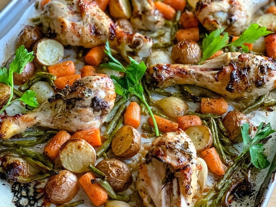 A sheet pan of chicken drumsticks.