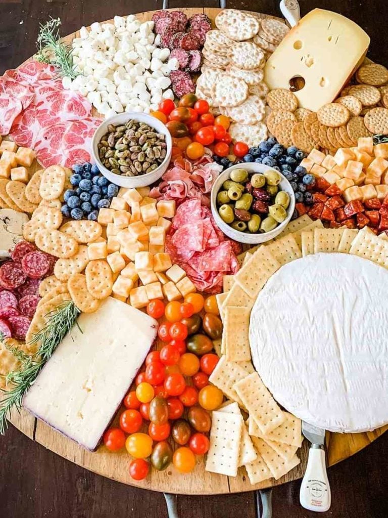 a wooden cheese and salami platter.