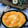 a skillet with rosemary garlic rolls.