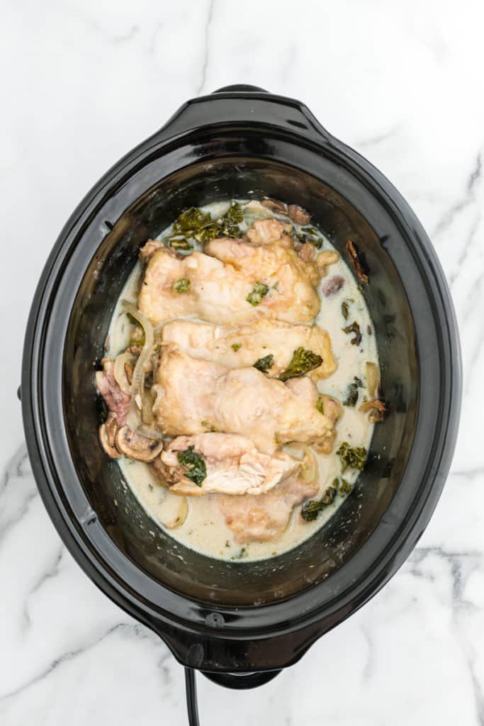 Cooked smothered chicken in crockpot.
