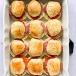 White baking dish filled with Italian sliders.