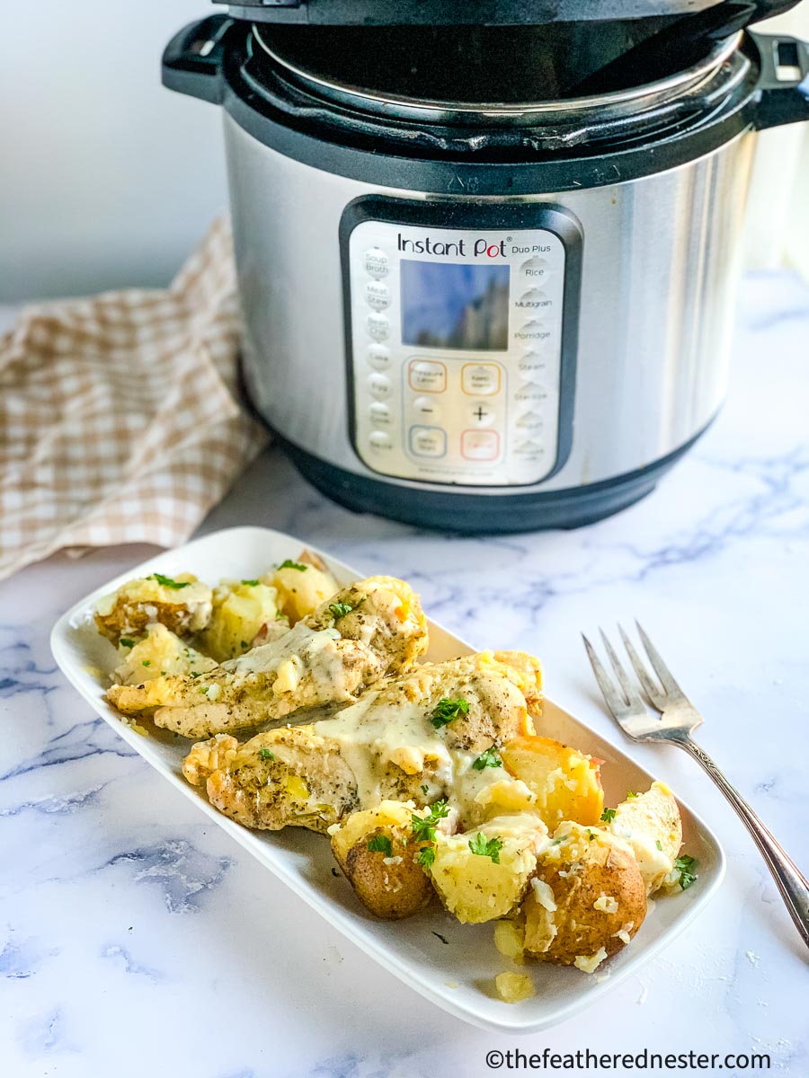 Photo of instant pot creamy ranch chicken and potatoes with cream cheese.