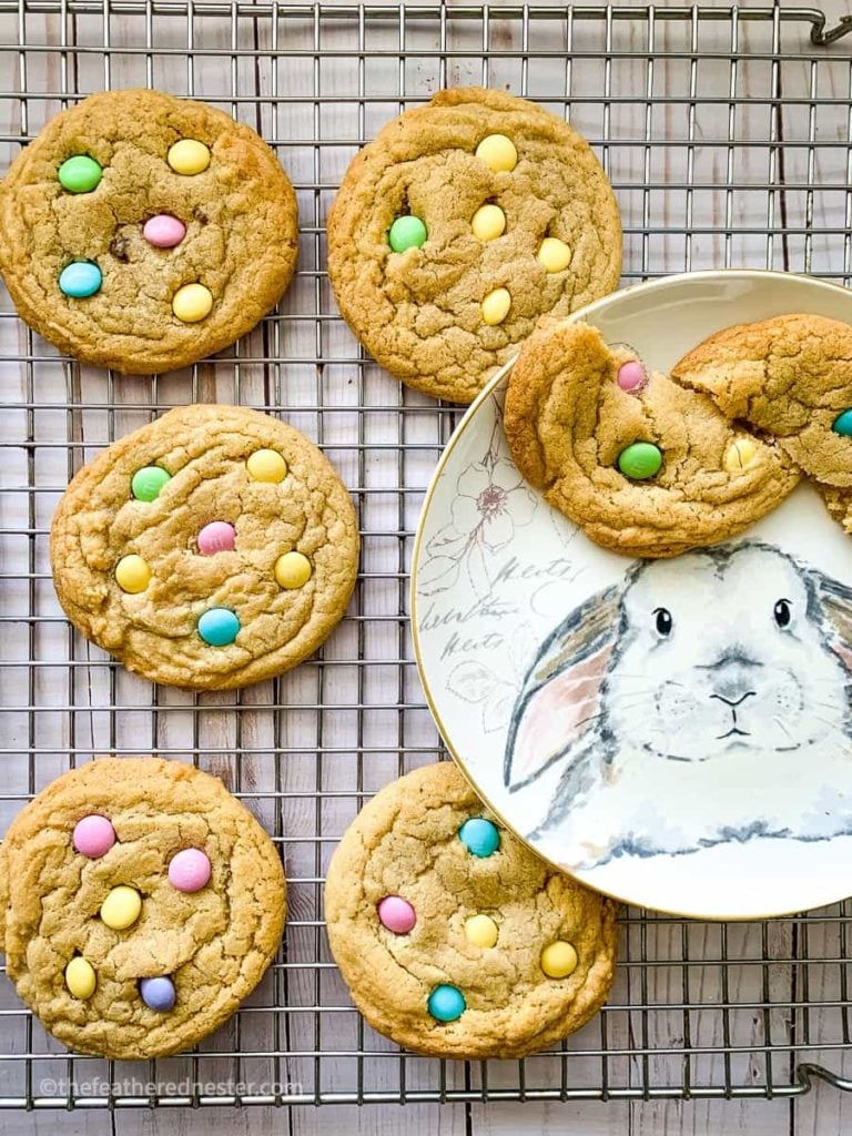 M&M easter cookies on a cooling rack and on top of a bunny plate