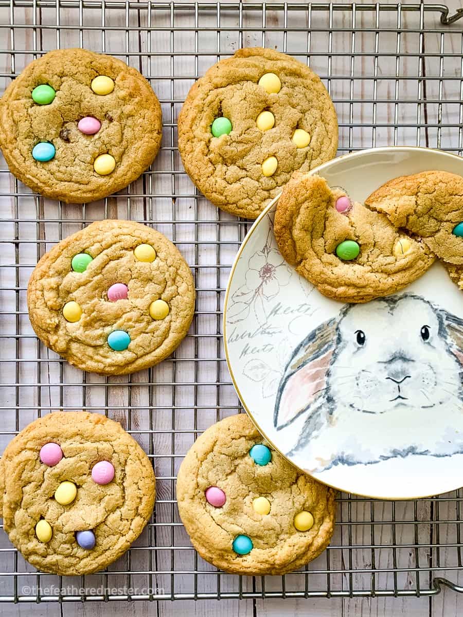 M&M Cookies on a cooling rack and bunny plate