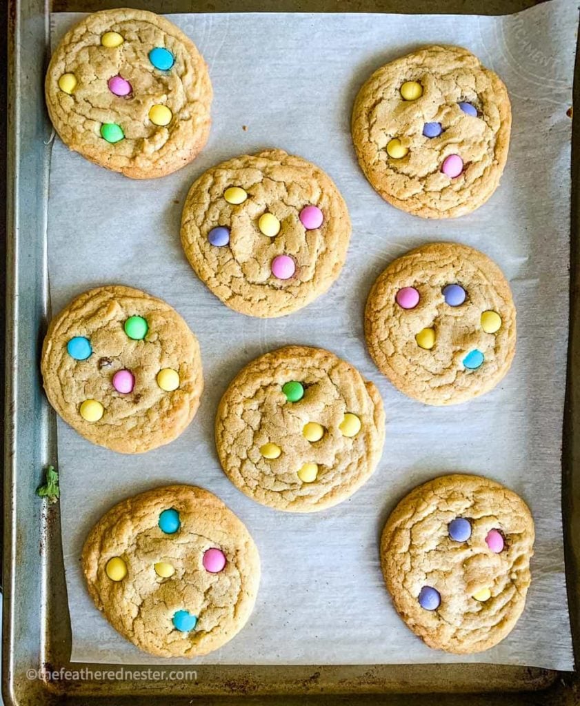 A baking tray of cookies with pastel colored M&Ms which are great ideas