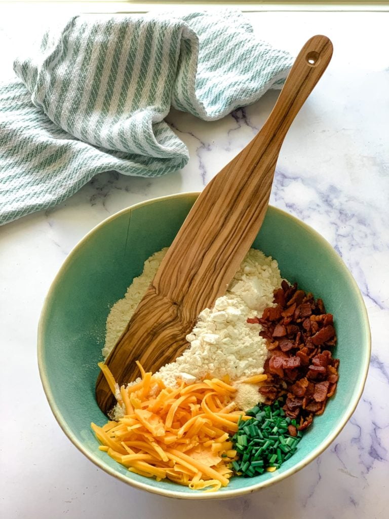 flour, cheese, bacon, and chives in a bowl