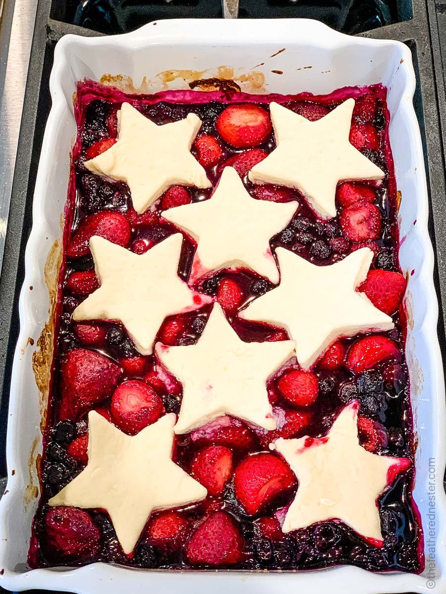 Strawberry blueberry cobbler with star shaped biscuit topping.