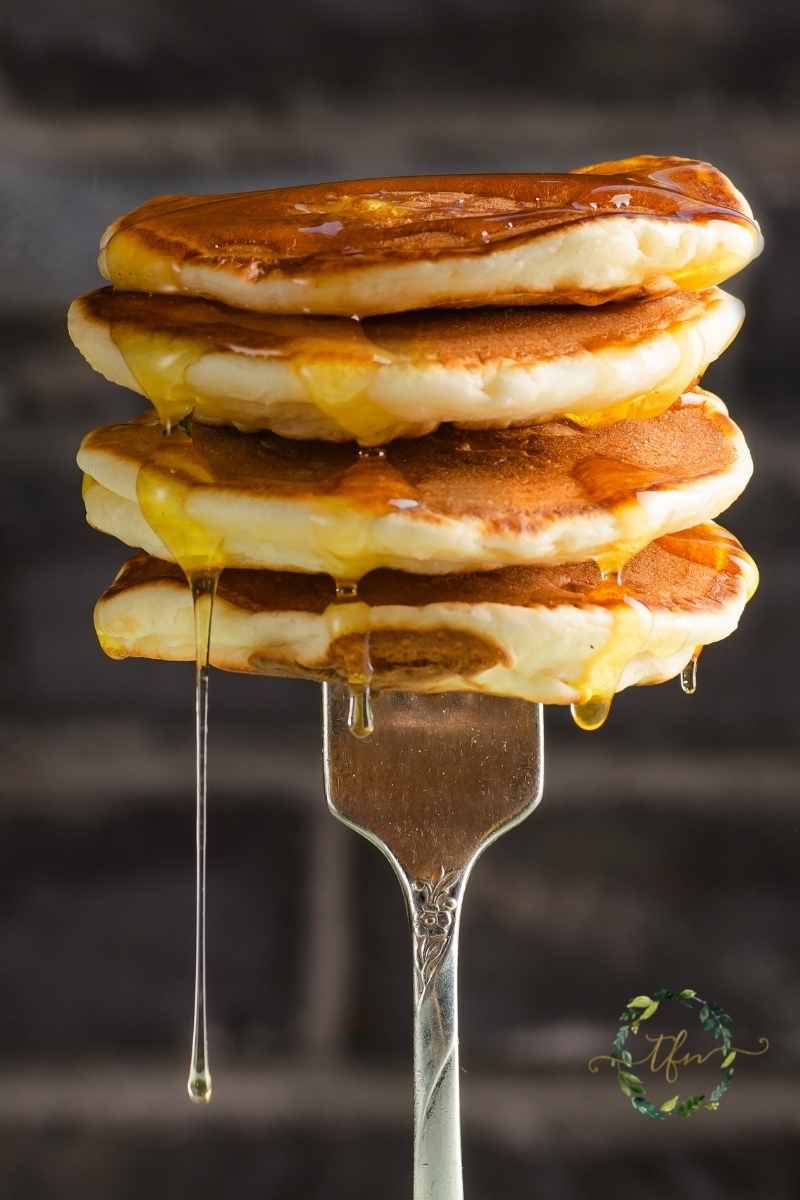 A fork holding up a stack of dollar pancakes.