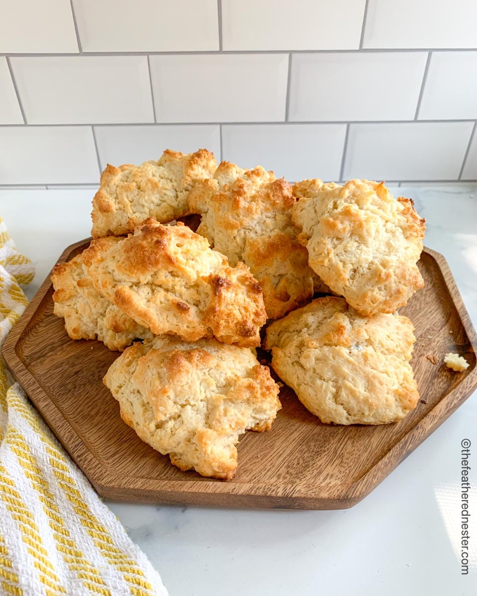 a wooden platter of drop biscuits made with Bisquick.