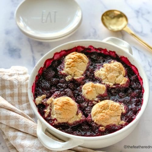 a casserole dish baked bisquick blackberry cobbler ready to serve.