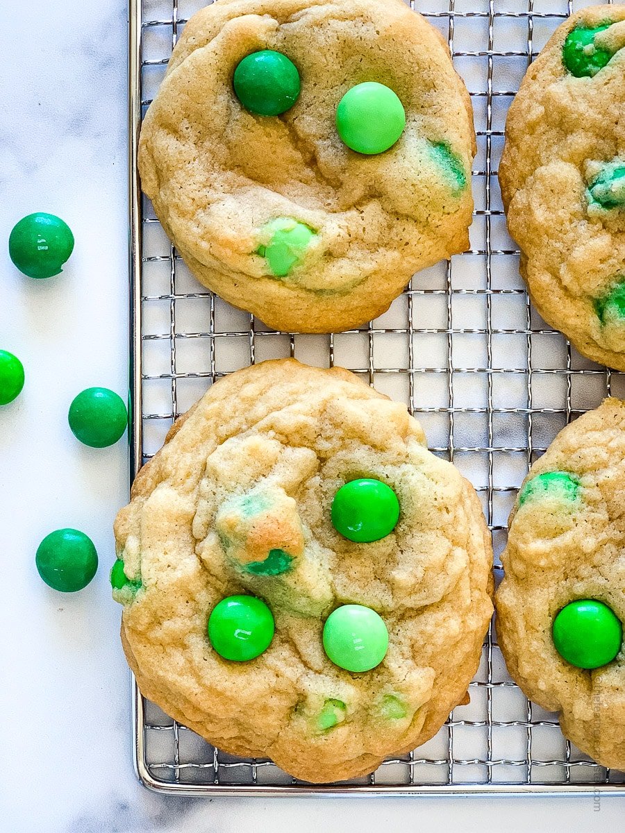 pressing the m and ms into cookies.