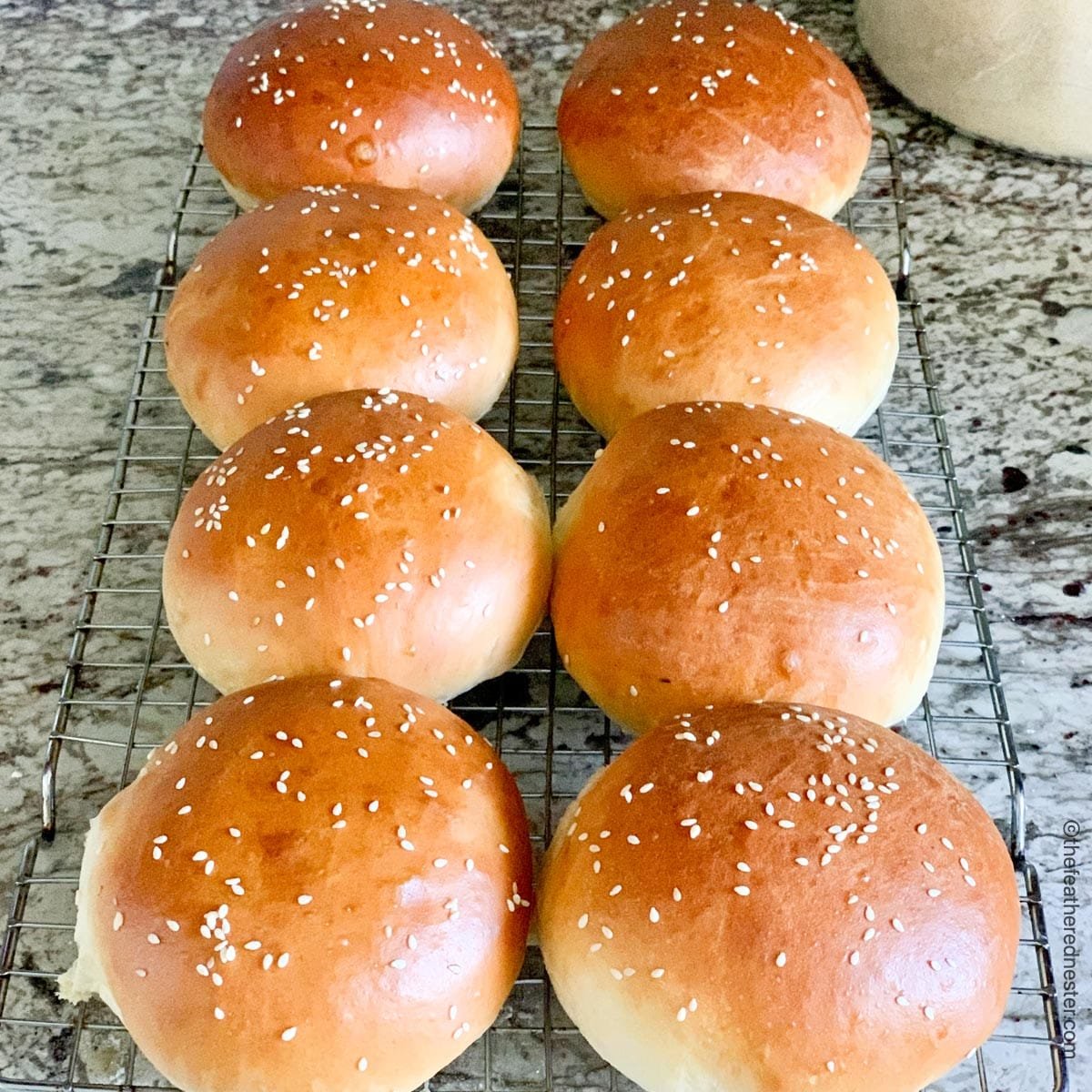 burger buns cooling on a cooling rack.
