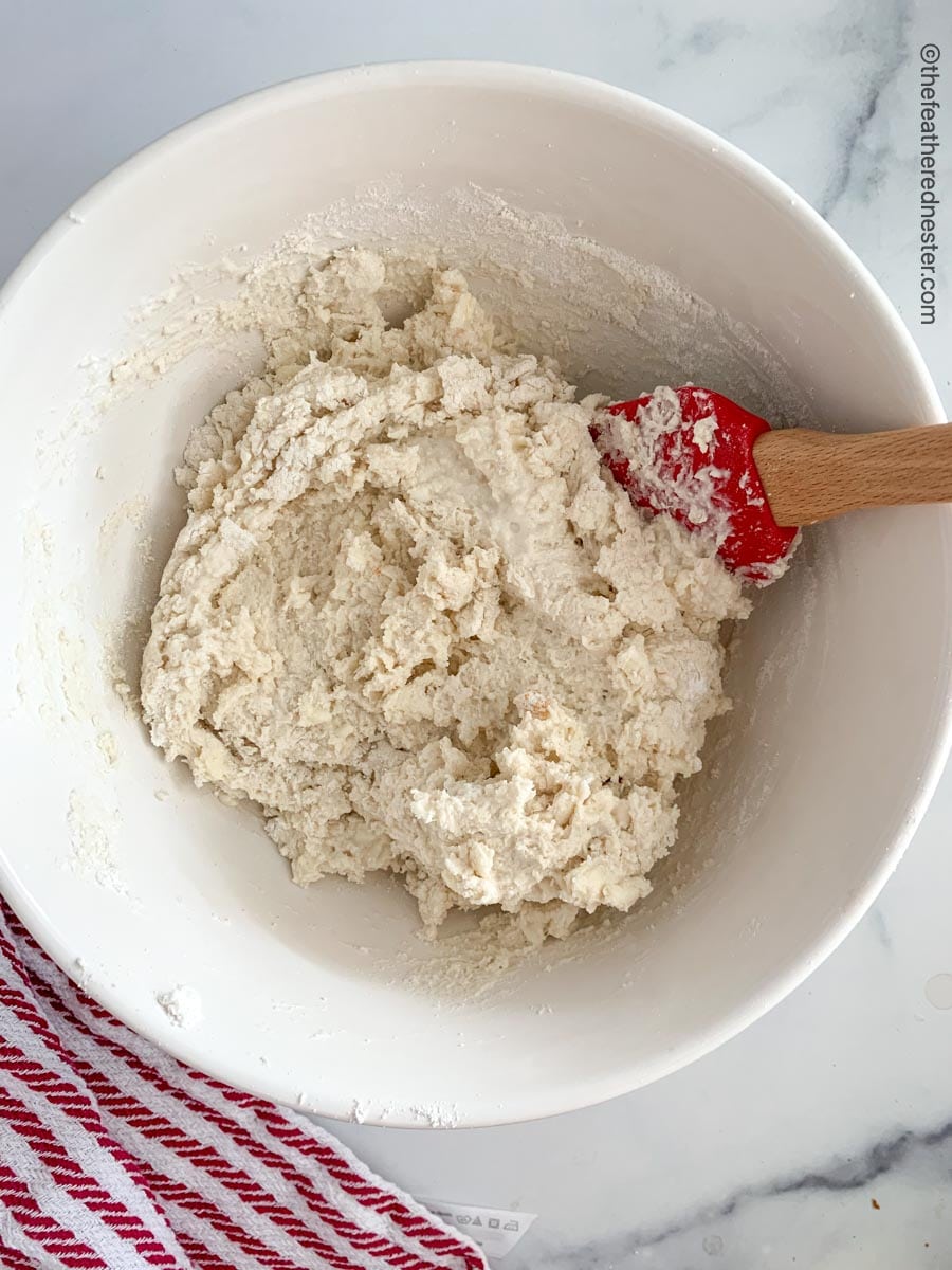 Mixing the dough on a bowl.