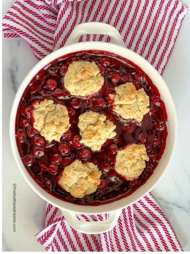 Baked summer dessert with cherries, ready to serve.