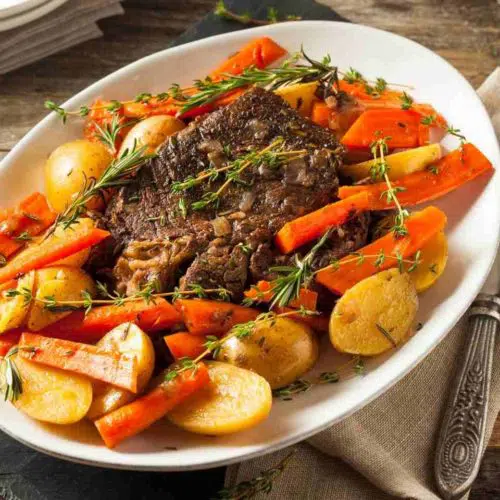 platter of pot roast with potatoes and carrots