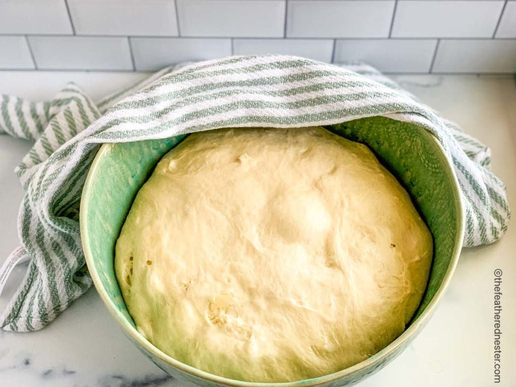 sourdough bread dough rising in a bowl