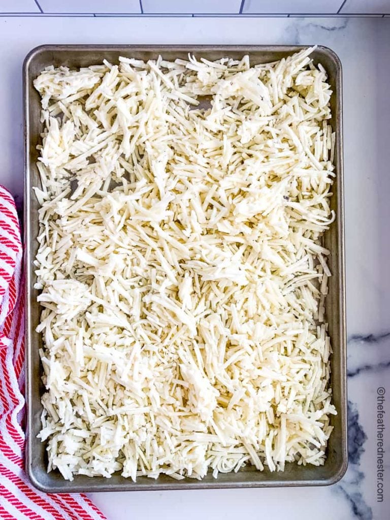 a baking sheet of frozen hash brown potatoes