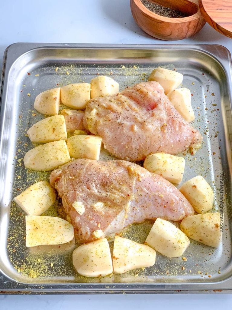 a roasting pan of turkey tenderloins and cut potatoes